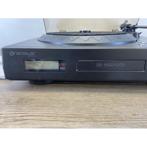 1484 - A Neostar NTCD1B music system comprising three-speed turntable, cassette player and CD player/record... 