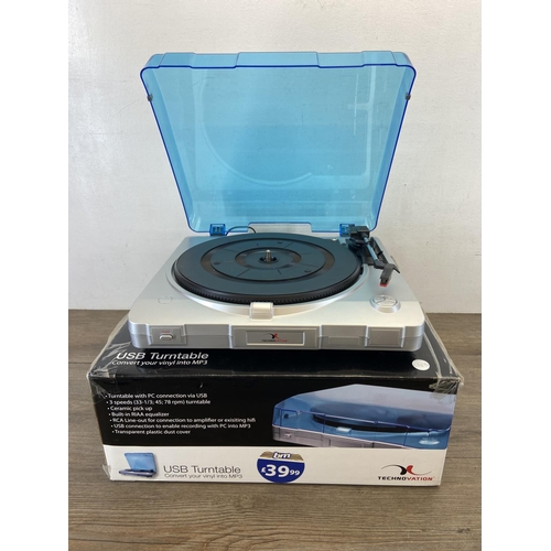 1497 - Four items, one boxed Technovation 229700 USB turntable, one Philips CDR802 three disc changer CD re... 