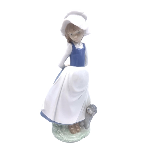 1260 - Four Nao by Lladro porcelain figurines - largest approx. 24cm high