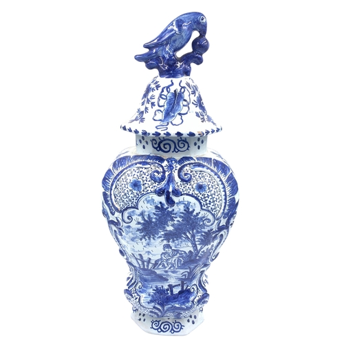 1261 - An antique Delftware blue and white ceramic jar and cover with bird finial - approx. 46cm high