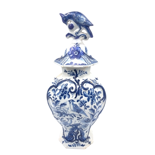 1263 - An antique Delftware blue and white ceramic jar and cover with bird finial - approx. 32cm high