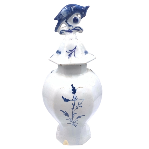 1263 - An antique Delftware blue and white ceramic jar and cover with bird finial - approx. 32cm high