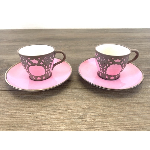 1265 - An early 20th century The Paragon China pink glazed ceramic fifteen piece coffee set with white meta... 