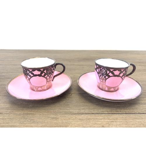 1265 - An early 20th century The Paragon China pink glazed ceramic fifteen piece coffee set with white meta... 