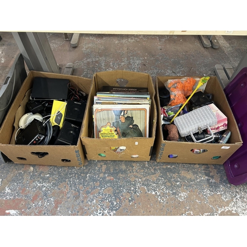 1654 - Three boxes containing Dragon Carp fishing reel, LP vinyl records, Fenton Karaoke amp and speakers e... 