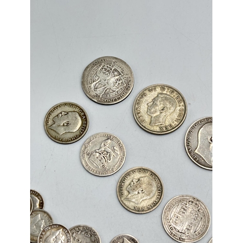 2291 - A collection of British silver coins to include two 92.5% silver florins, five 92.5% silver shilling... 