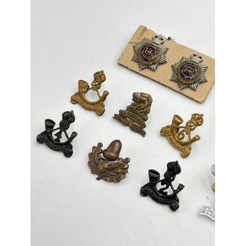 2366 - Ten military cap badges