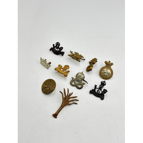 2367 - Ten military cap badges