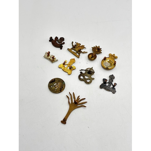 2367 - Ten military cap badges