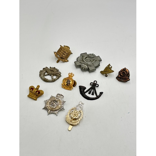 2369 - Ten military cap badges