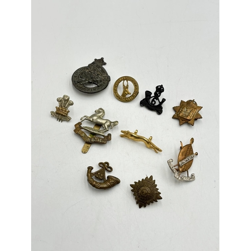 2371 - Ten military cap badges