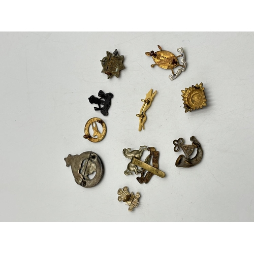 2371 - Ten military cap badges