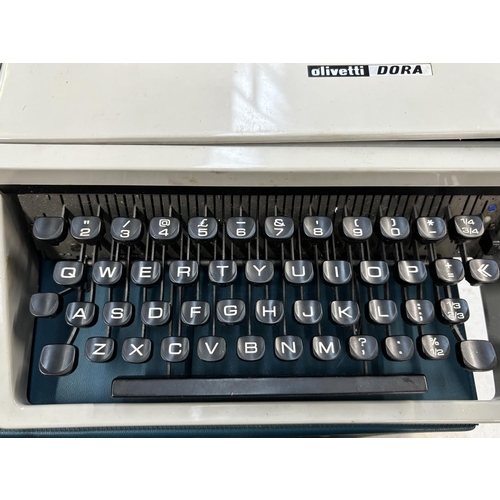 1524 - Two cased portable typewriters, one Empire Aristocrat and one Olivetti Dora