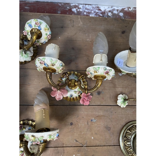 17 - Six pieces of 19th century style brass and floral decorated porcelain lighting, five wall sconces an... 