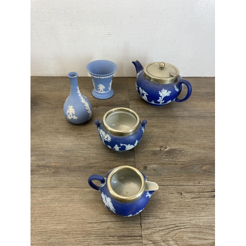 401 - Sixteen pieces of Wedgwood blue Jasperware to include 19th century silver plated three piece tea set... 