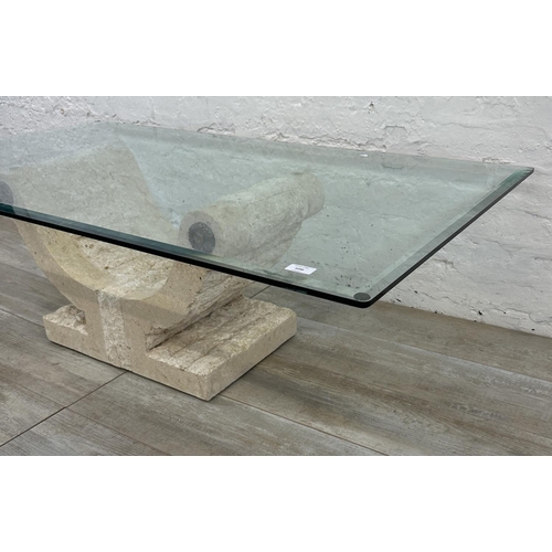 65 - A modern limestone effect fibreglass and bevelled glass top coffee table - approx. 43cm high x 76cm ... 