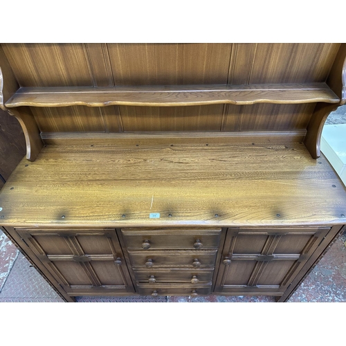 66 - An Ercol Golden Dawn elm and beech dresser - approx. 170cm high x 146cm wide x 50cm deep