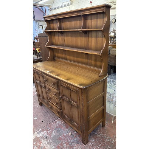 66 - An Ercol Golden Dawn elm and beech dresser - approx. 170cm high x 146cm wide x 50cm deep