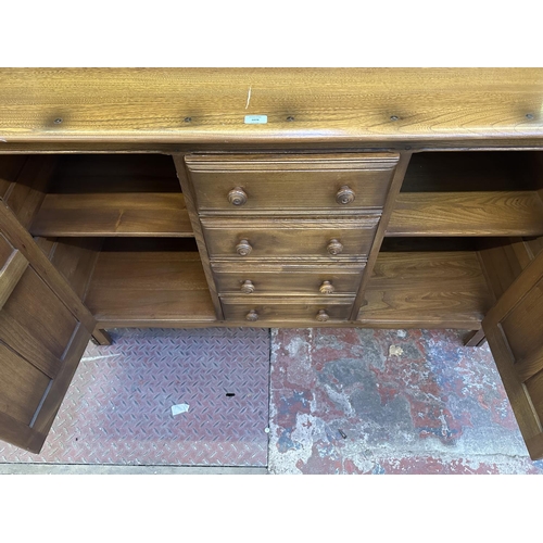 66 - An Ercol Golden Dawn elm and beech dresser - approx. 170cm high x 146cm wide x 50cm deep