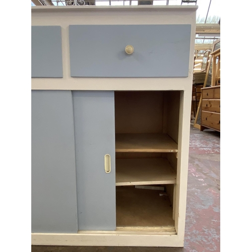 117 - A mid 20th century blue and white painted kitchen cabinet with laminate top - approx. 85cm high x 84... 