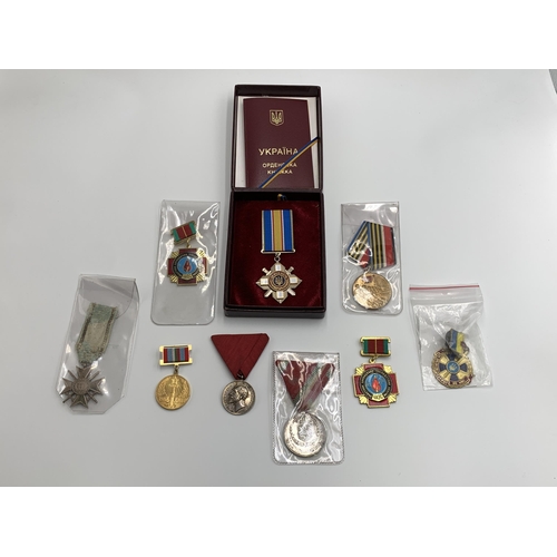 2369 - Nine Eastern European military medals to include Ukraine Order for Courage, Bulgarian Cross of Brave... 