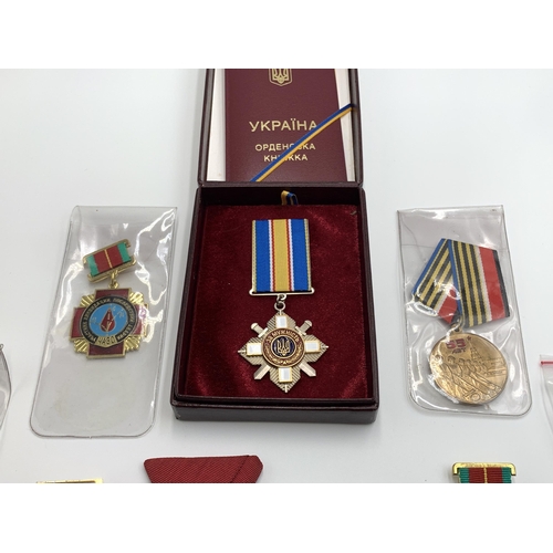 2369 - Nine Eastern European military medals to include Ukraine Order for Courage, Bulgarian Cross of Brave... 