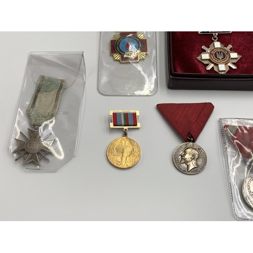 2369 - Nine Eastern European military medals to include Ukraine Order for Courage, Bulgarian Cross of Brave... 