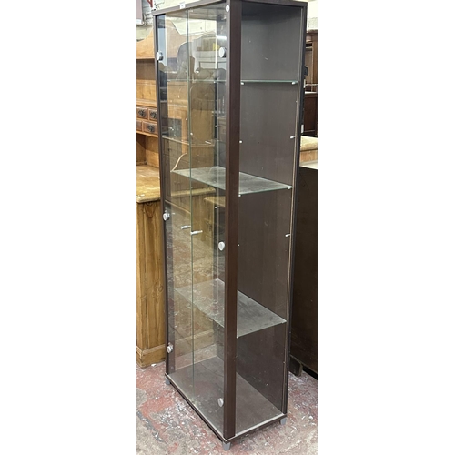 101 - A modern walnut effect and glass display cabinet with three glass shelves - approx. 172cm high x 58c... 