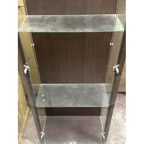 101 - A modern walnut effect and glass display cabinet with three glass shelves - approx. 172cm high x 58c... 