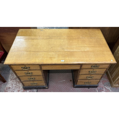 104 - A Victorian oak pedestal desk - approx. 76cm high x 136cm wide x 76cm deep