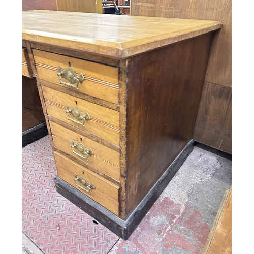 104 - A Victorian oak pedestal desk - approx. 76cm high x 136cm wide x 76cm deep