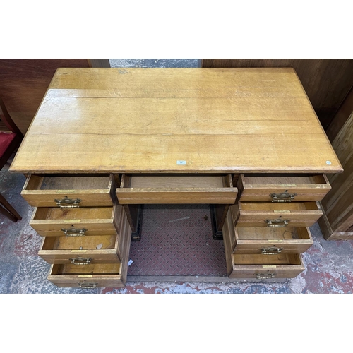 104 - A Victorian oak pedestal desk - approx. 76cm high x 136cm wide x 76cm deep