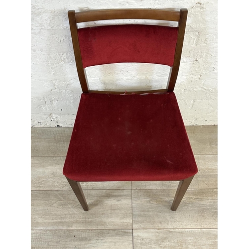 105 - Four mid 20th century G Plan teak and red fabric upholstered dining chairs