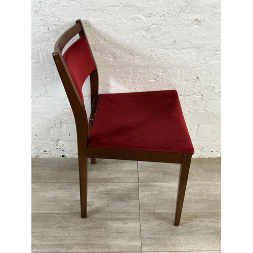 105 - Four mid 20th century G Plan teak and red fabric upholstered dining chairs