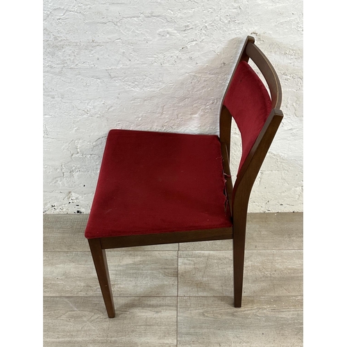 105 - Four mid 20th century G Plan teak and red fabric upholstered dining chairs