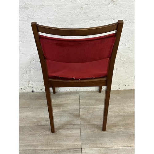 105 - Four mid 20th century G Plan teak and red fabric upholstered dining chairs