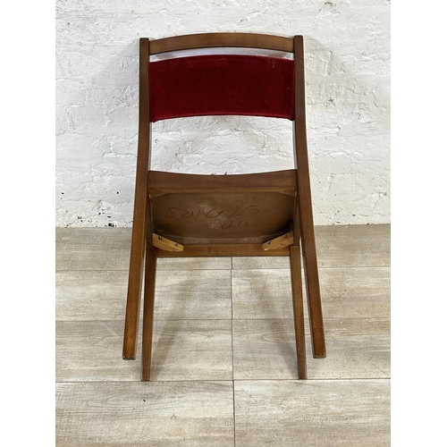 105 - Four mid 20th century G Plan teak and red fabric upholstered dining chairs