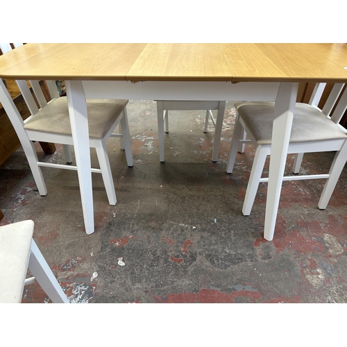 107 - A modern oak effect and white painted extending dining table and four chairs - approx. 74cm high x 8... 