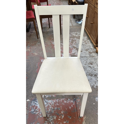 107 - A modern oak effect and white painted extending dining table and four chairs - approx. 74cm high x 8... 