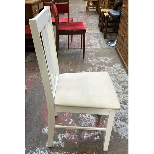 107 - A modern oak effect and white painted extending dining table and four chairs - approx. 74cm high x 8... 