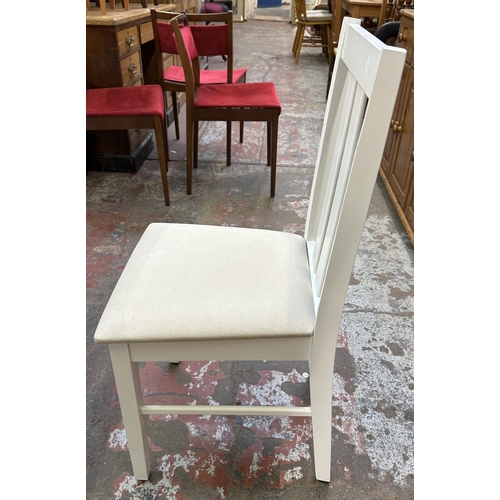 107 - A modern oak effect and white painted extending dining table and four chairs - approx. 74cm high x 8... 