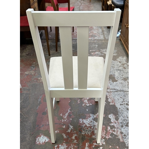 107 - A modern oak effect and white painted extending dining table and four chairs - approx. 74cm high x 8... 