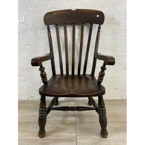 108 - A Victorian elm and beech farmhouse armchair - approx. 104cm high x 55cm wide x 48cm deep