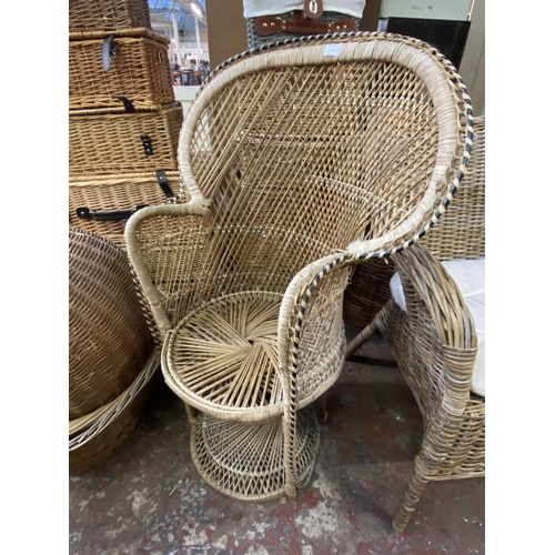 114 - Seventeen pieces of wicker furniture to include baskets, peacock chair etc.