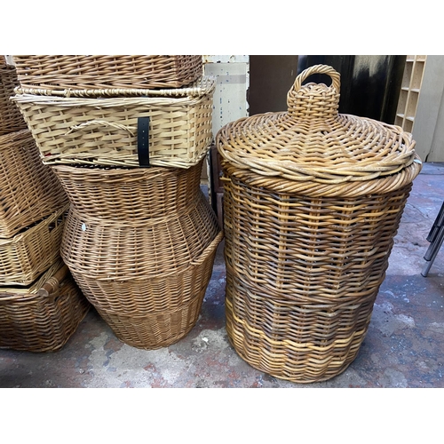 114 - Seventeen pieces of wicker furniture to include baskets, peacock chair etc.