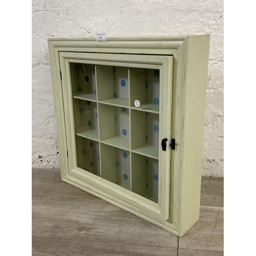 119 - A modern green painted wall hanging display cabinet - approx. 50cm high x 50cm wide x 10cm deep