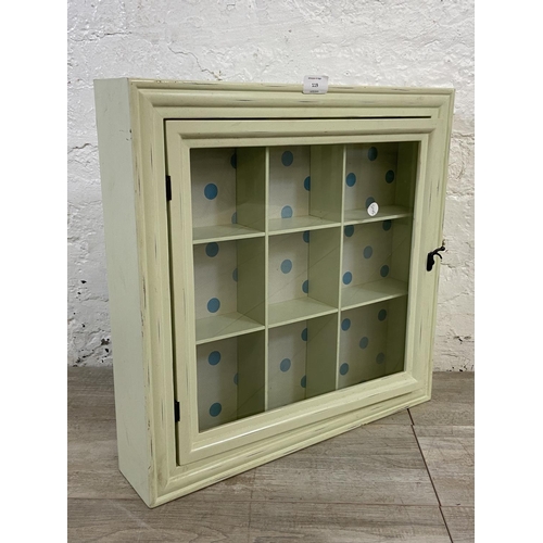 119 - A modern green painted wall hanging display cabinet - approx. 50cm high x 50cm wide x 10cm deep