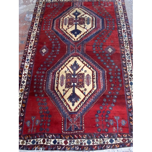 12 - A Persian hand knotted rug - approx. 260cm x 170cm