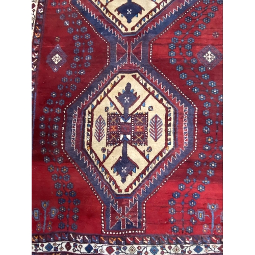 12 - A Persian hand knotted rug - approx. 260cm x 170cm