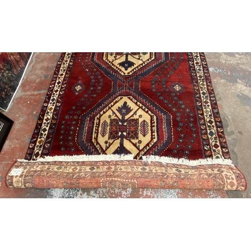 12 - A Persian hand knotted rug - approx. 260cm x 170cm